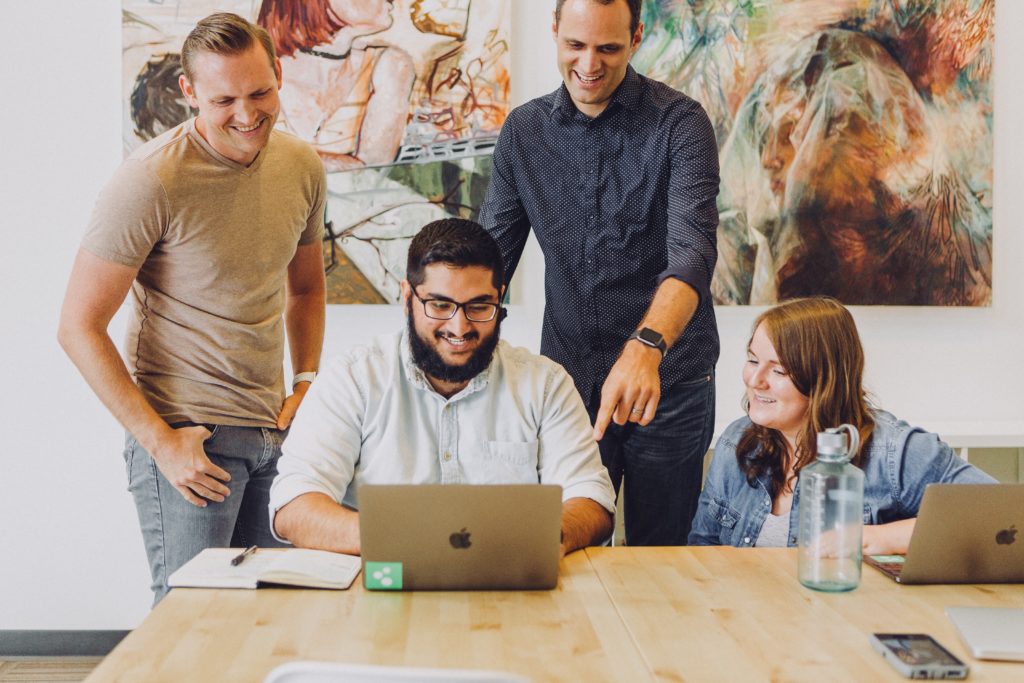 Sprint team mentoring startup founders around a table